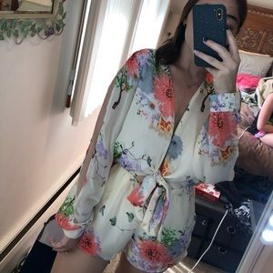Open long sleeve floral romper